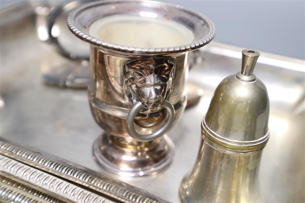A pair of silver plated entree dishes with covers and handles, a plated butter dish, two condiments, a small vase and a trinket box